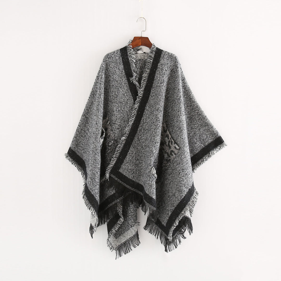 Dam Oversize Ruana poncho i en ullblandning med fringes och kontrasterande edge