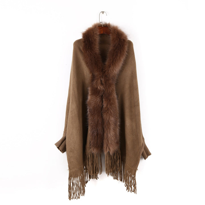 Dam poncho med fuskpälskrage och fringed fåll