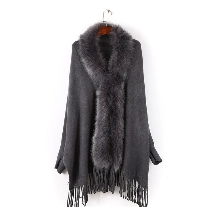 Dam poncho med fuskpälskrage och fringed fåll