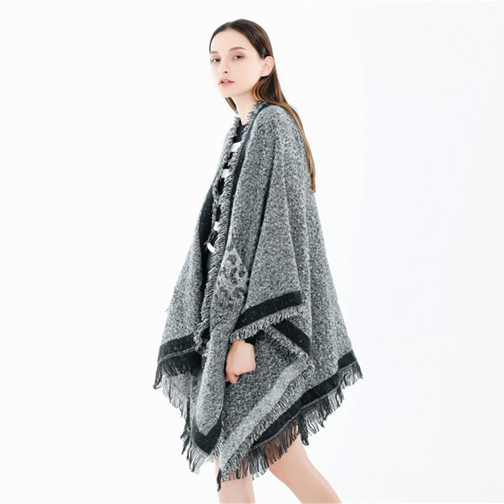 Dam Oversize Ruana poncho i en ullblandning med fringes och kontrasterande edge