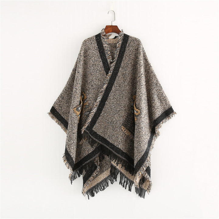 Dam Oversize Ruana poncho i en ullblandning med fringes och kontrasterande edge