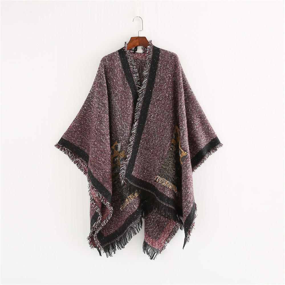 Dam Oversize Ruana poncho i en ullblandning med fringes och kontrasterande edge
