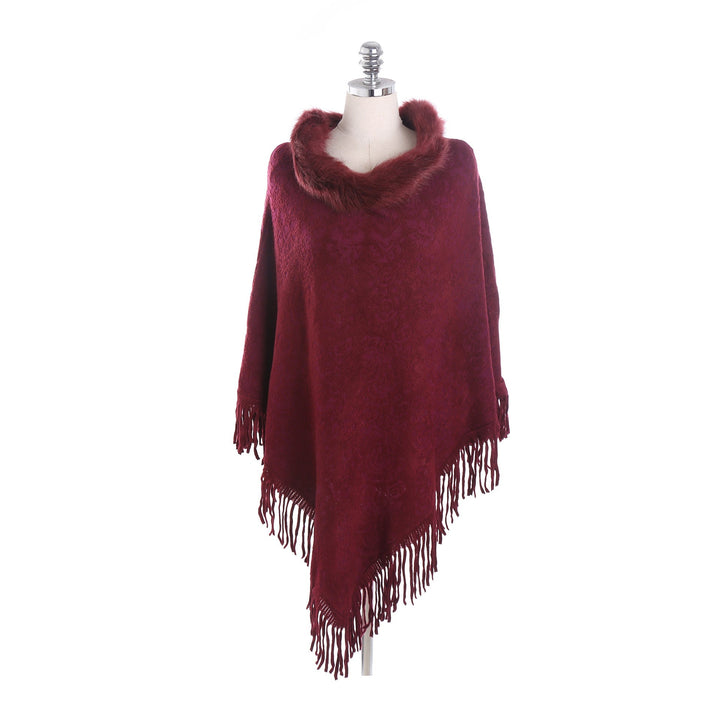 Dam poncho-Ruana med fuskpälskrage, structured jacquard och fransfåll