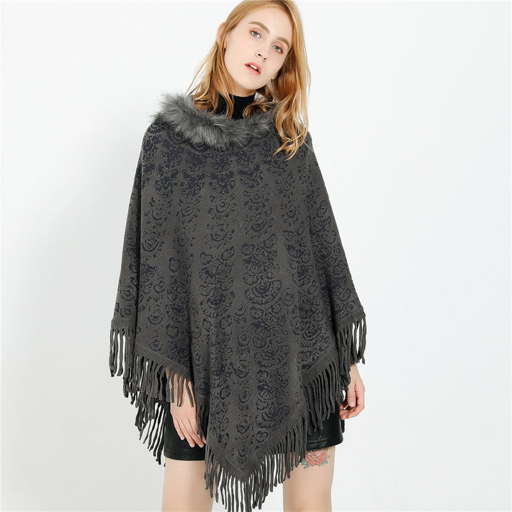 Dam poncho-Ruana med fuskpälskrage, structured jacquard och fransfåll