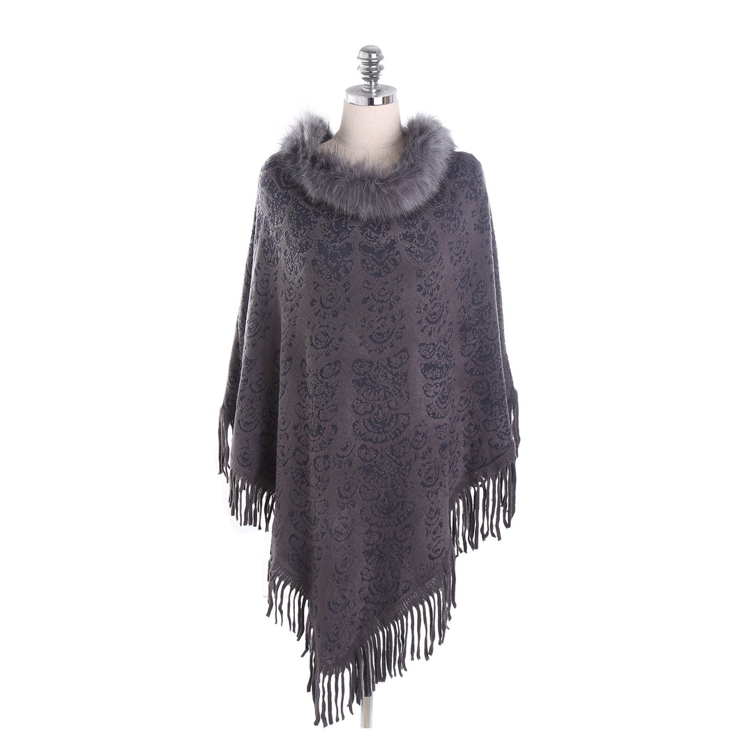 Dam poncho-Ruana med fuskpälskrage, structured jacquard och fransfåll