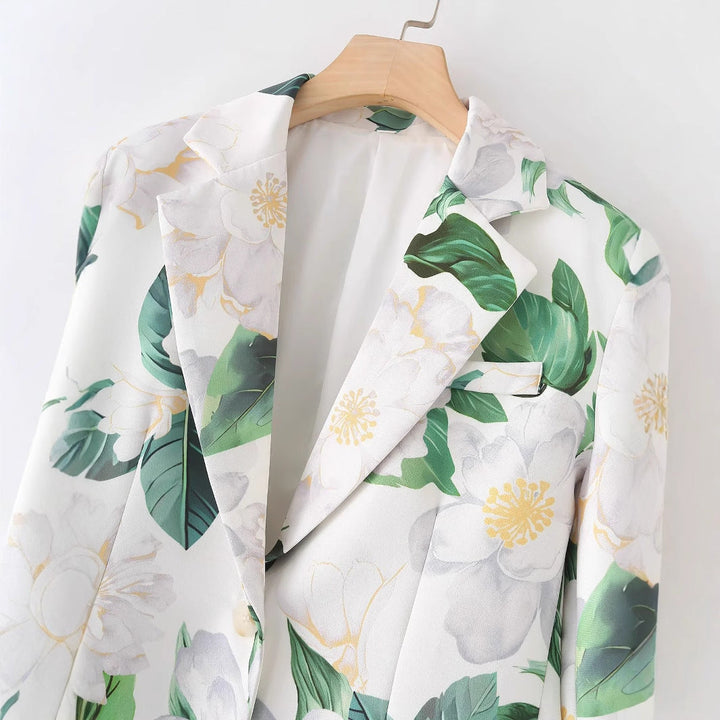 Dam floral printed lång blazer med lapel krage och welt fickor