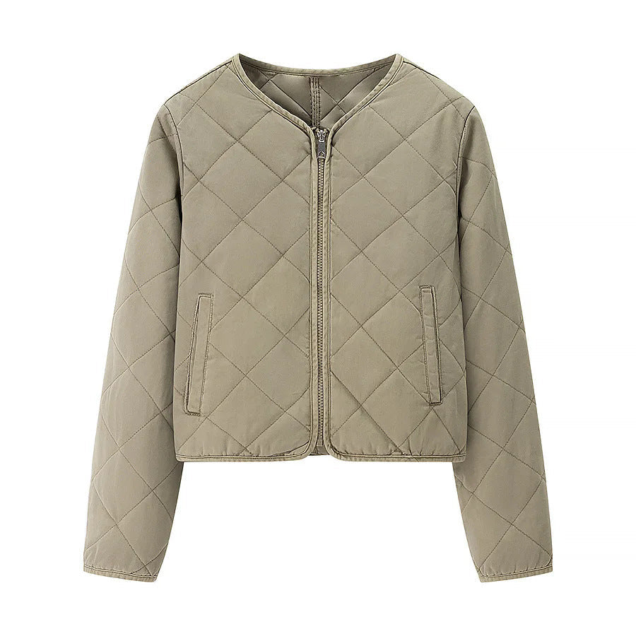 Dam kort jacka i boxy skärning med diamond quiltning, rounded fåll och concealed dragkedja