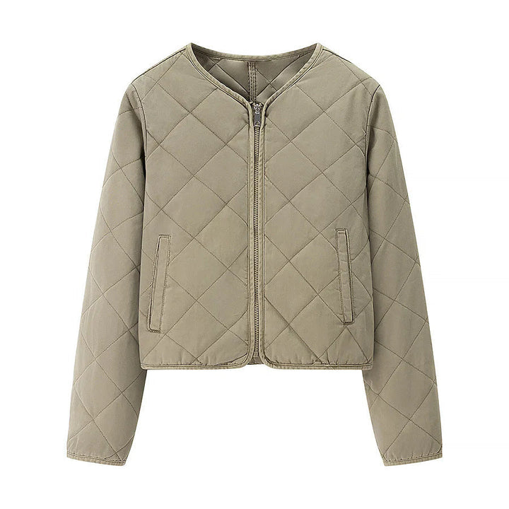 Dam kort jacka i boxy skärning med diamond quiltning, rounded fåll och concealed dragkedja