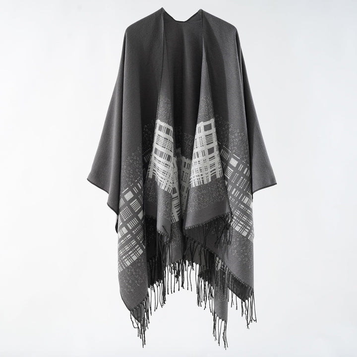 Dam ullblandning axel poncho med jacquard mönster och fransfåll
