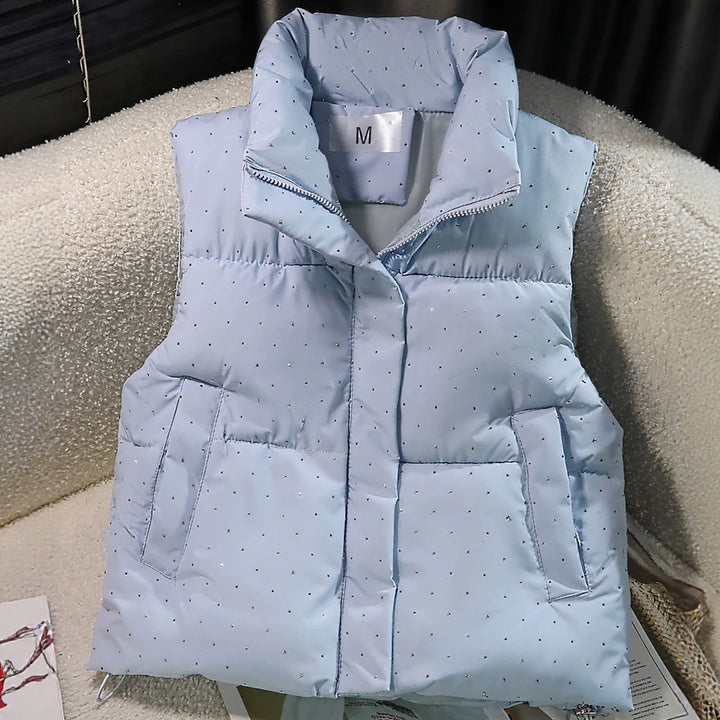 Dam non-quiltad sleeveless thermal väst med high standing krage, concealed dragkedja placket, och fine dot tryck