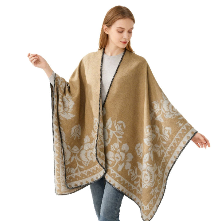 Dam poncho med floral jacquard structure och fine overlock seam