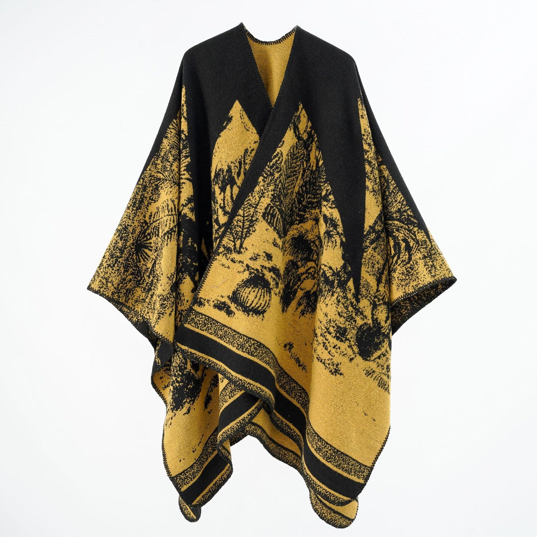 Dam capeponcho tillverkad av ullblandning med two-tone jacquard structure och decorative stitch border