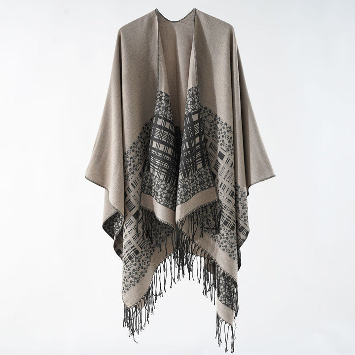 Dam ullblandning axel poncho med jacquard mönster och fransfåll