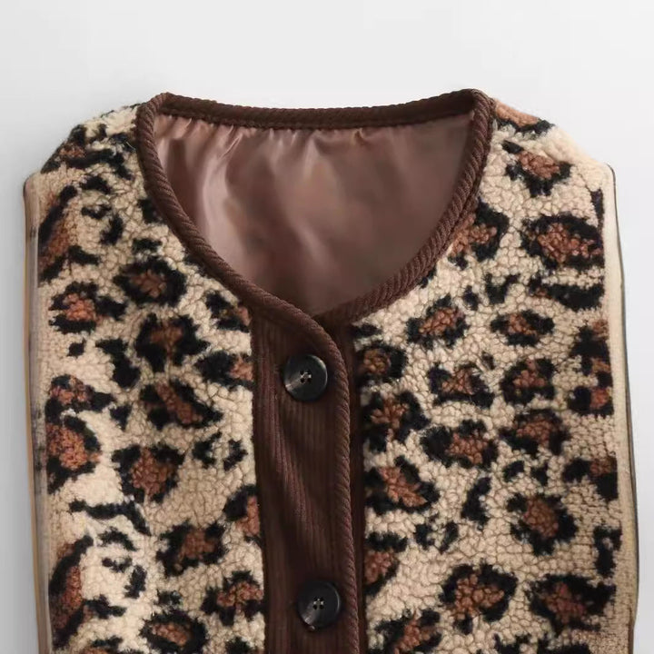 Dam faux sheepskin jacka med leopard mönster, manchester kant, full knäppning, och påsydda fickor