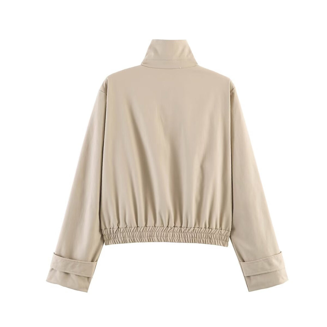 Dam kort skuren minimalistisk blouson jacka gjord mjuk vegan läder med a slagkrage och elastic fåll