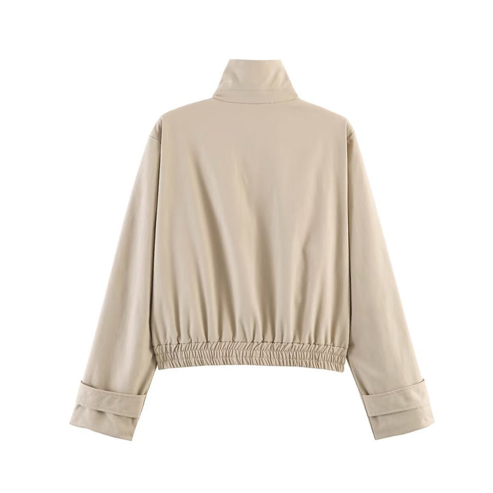 Dam kort skuren minimalistisk blouson jacka gjord mjuk vegan läder med a slagkrage och elastic fåll