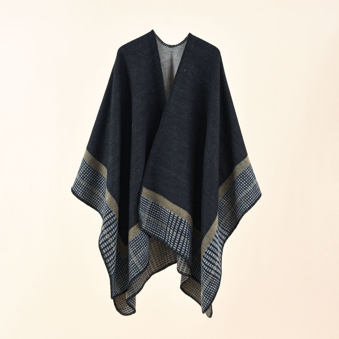 Dam Oversize capeponcho tillverkad av ullblandning med boxy fall och fine border structure
