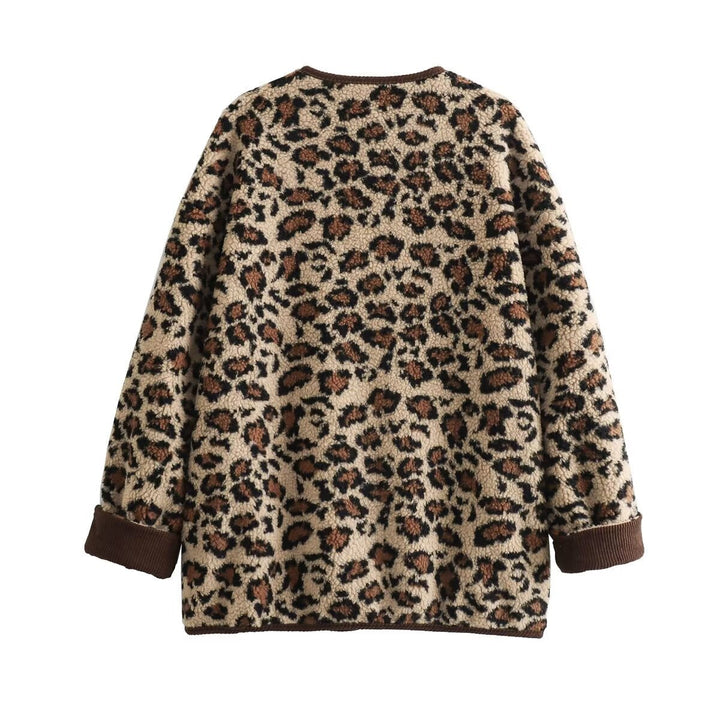 Dam faux sheepskin jacka med leopard mönster, manchester kant, full knäppning, och påsydda fickor