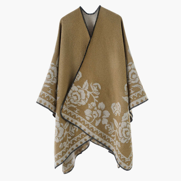Dam poncho med floral jacquard structure och fine overlock seam
