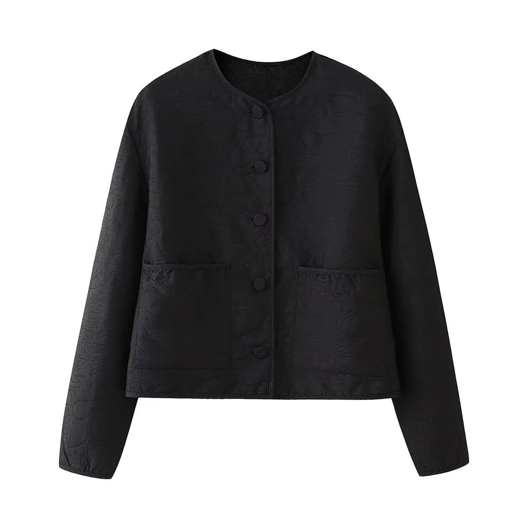 Dam quiltad kort jacka med crew neck, concealed snap knäppning och påsydda fickor