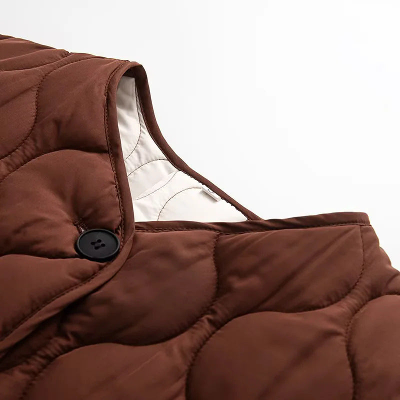 Dam quiltad övergångsjacka med organic wave quiltning, knäppning, och inserted sidofickor
