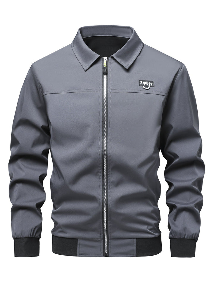 Herr Collar-Zip Blouson Tillverkad av Softshell med Ribbad Muddar och Smiley Patch