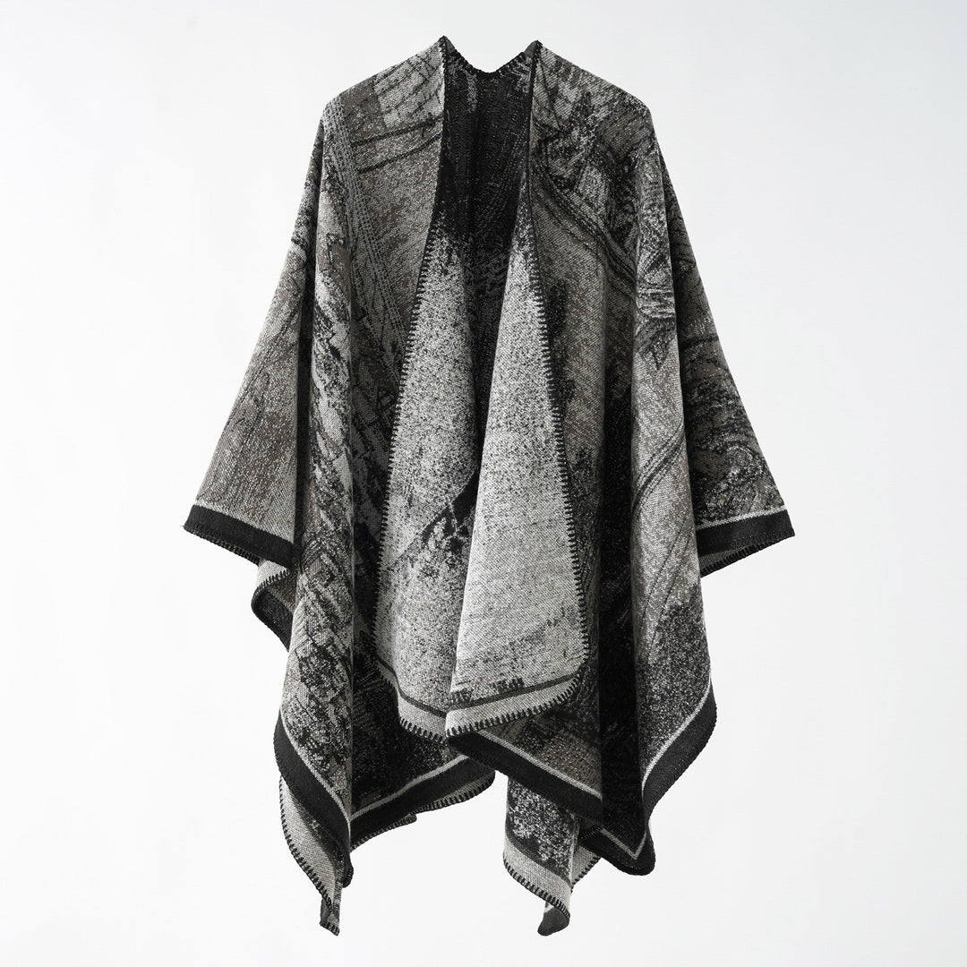 Dam jacquard stickad cape med textured woven look och öppen front