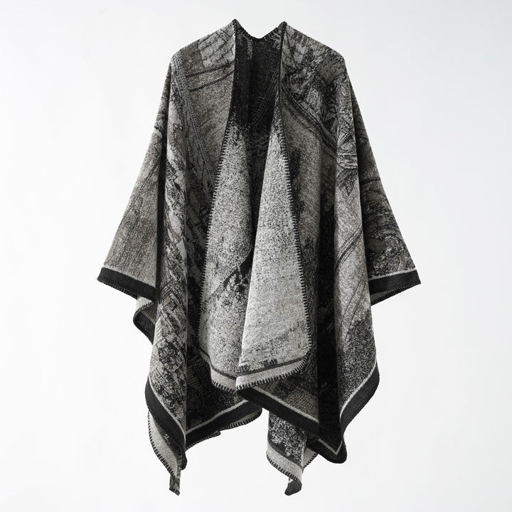 Dam jacquard stickad cape med textured woven look och öppen front