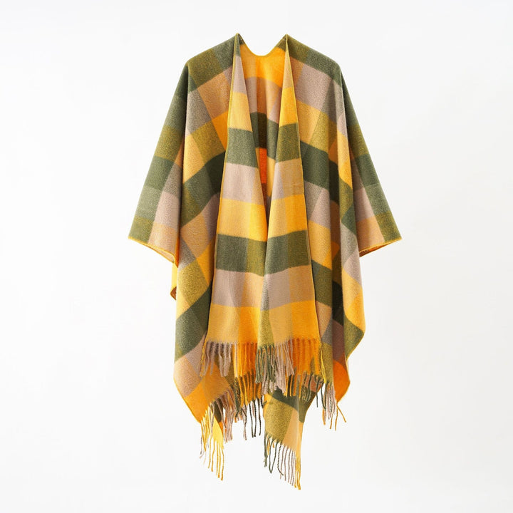 Dam Oversize Wrap poncho tillverkad av ullblandning med graphic diamond mönster och fringed fåll