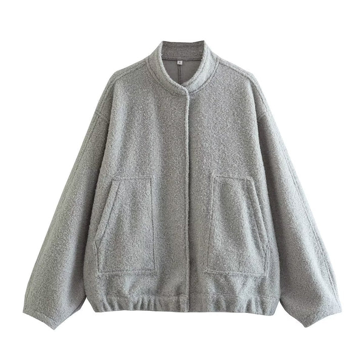 Dam oversized teddy kappa med ståkrage, påsydda fickor, och straight fåll
