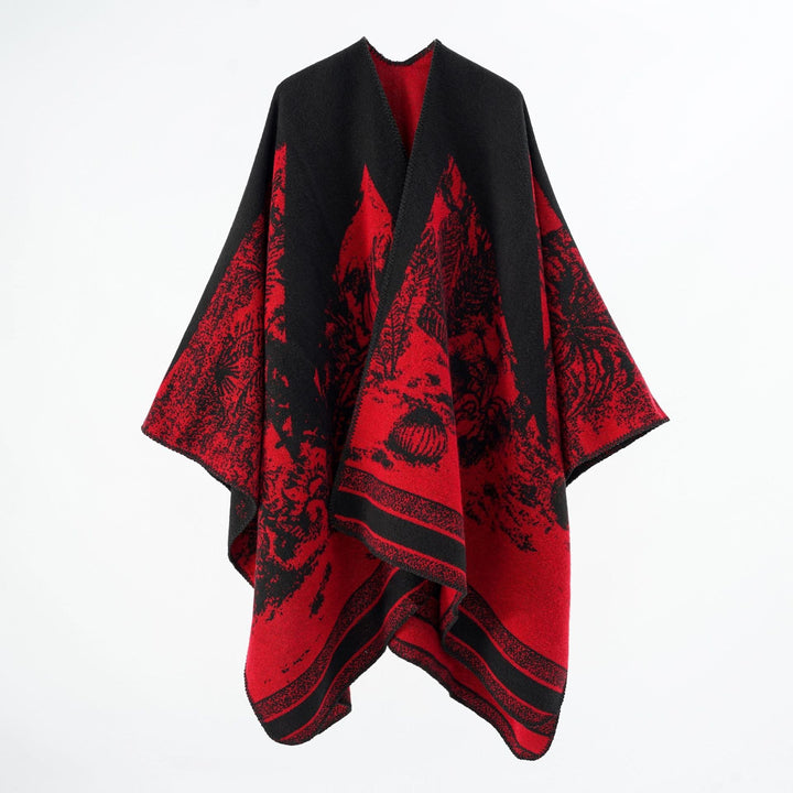 Dam capeponcho tillverkad av ullblandning med two-tone jacquard structure och decorative stitch border