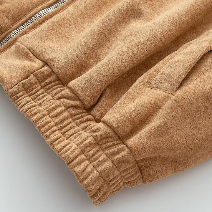 Dam kort jacka in mocka look med dragkedja och elastic fåll