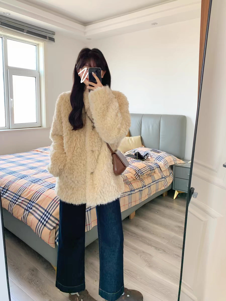 Dam teddy kappa gjord faux fur med oversize skärning och sidofickor