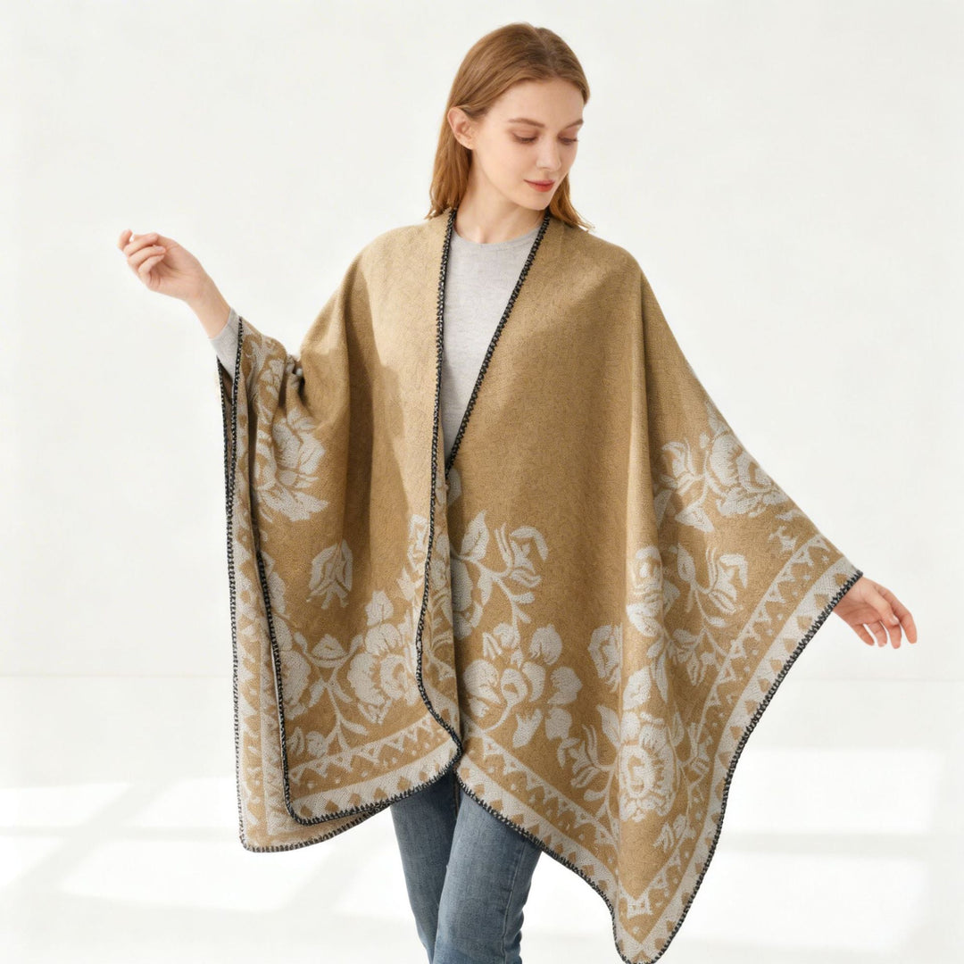 Dam poncho med floral jacquard structure och fine overlock seam
