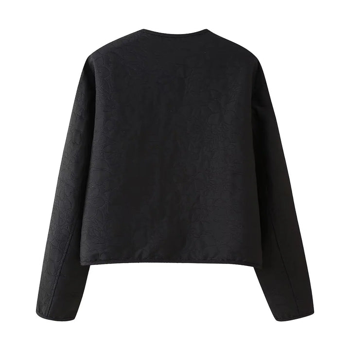Dam quiltad kort jacka med crew neck, concealed snap knäppning och påsydda fickor