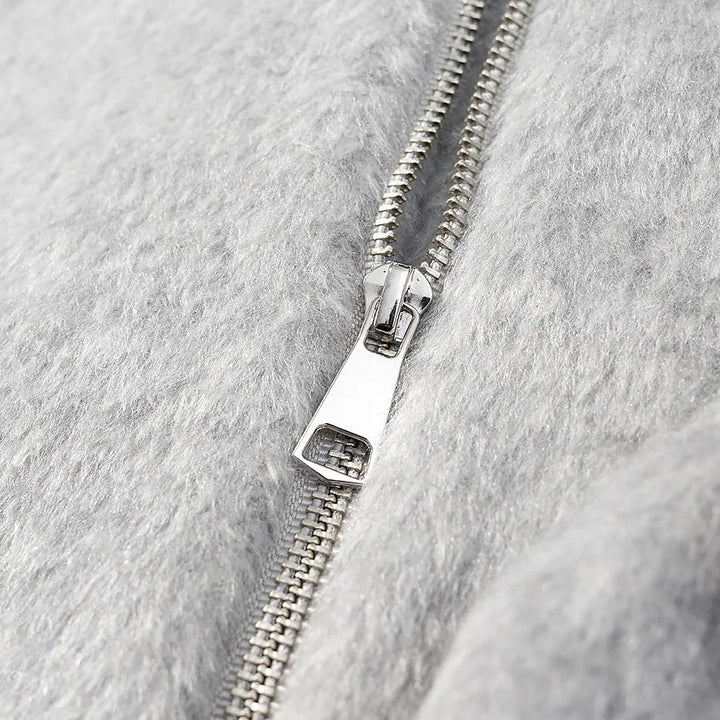 Dam kort oversized jacka i ullblandning med voluminous fuskpälskrage och patch flap fickor