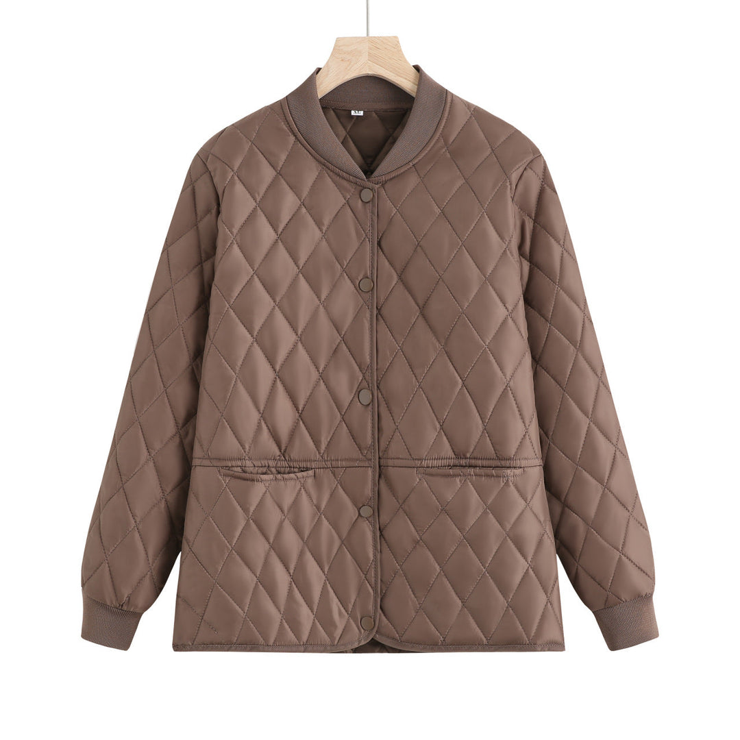 Dam quiltad övergångsjacka med diamond stitching och ribbed krage