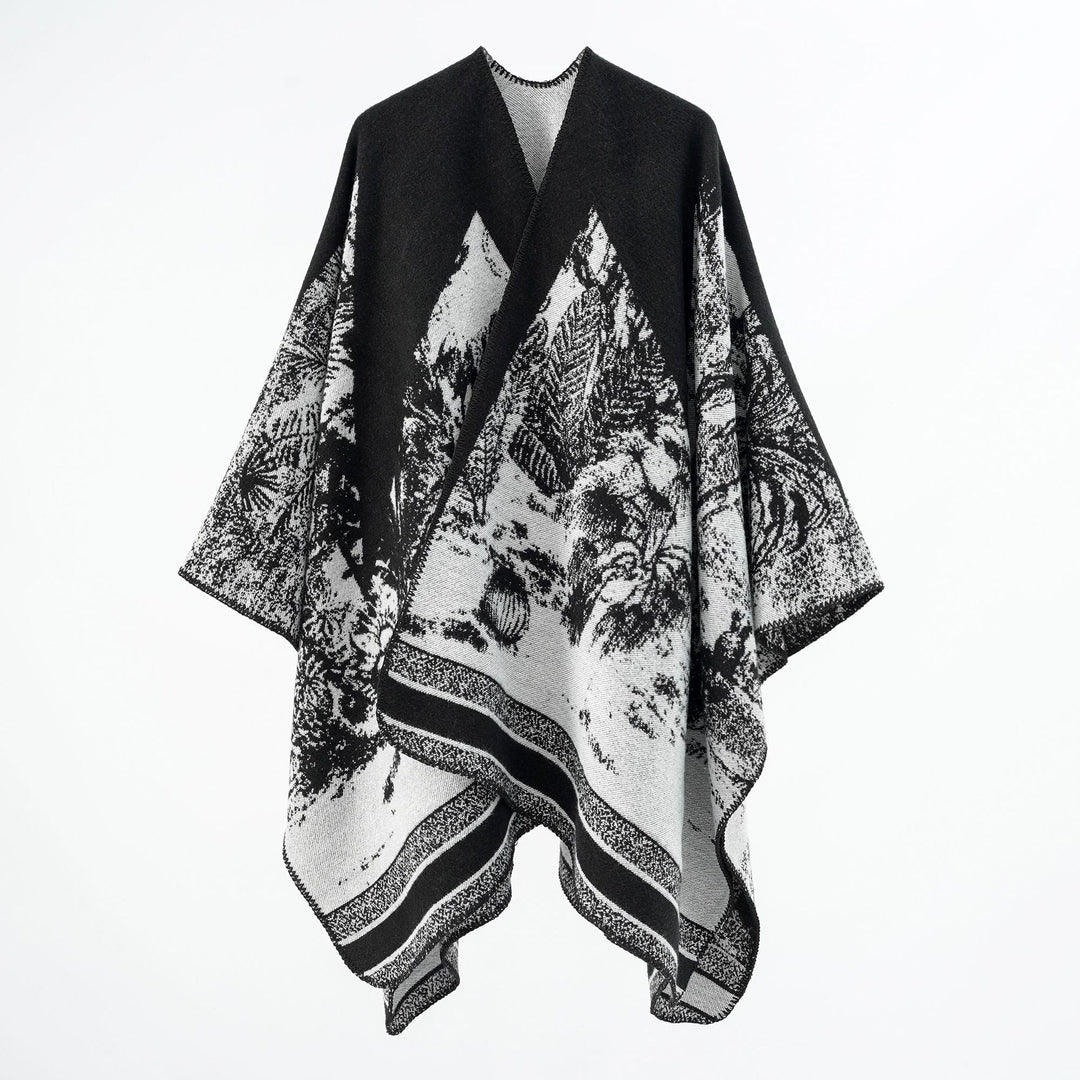 Dam capeponcho tillverkad av ullblandning med two-tone jacquard structure och decorative stitch border