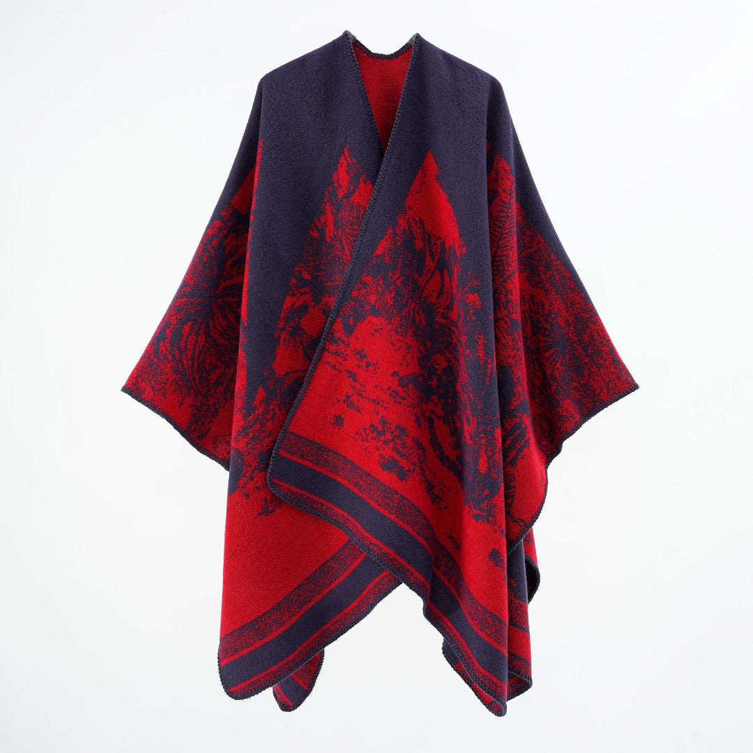 Dam capeponcho tillverkad av ullblandning med two-tone jacquard structure och decorative stitch border