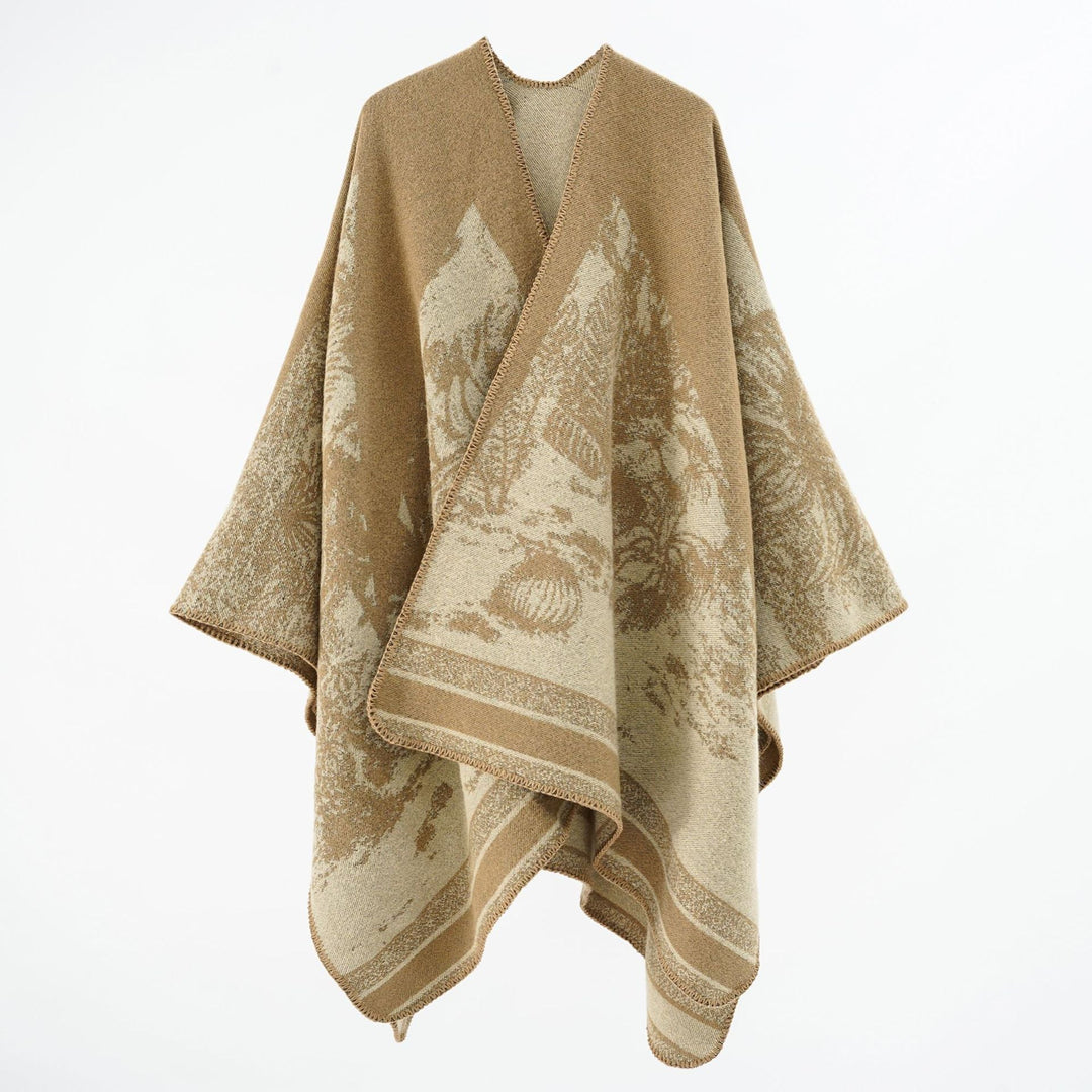 Dam capeponcho tillverkad av ullblandning med two-tone jacquard structure och decorative stitch border