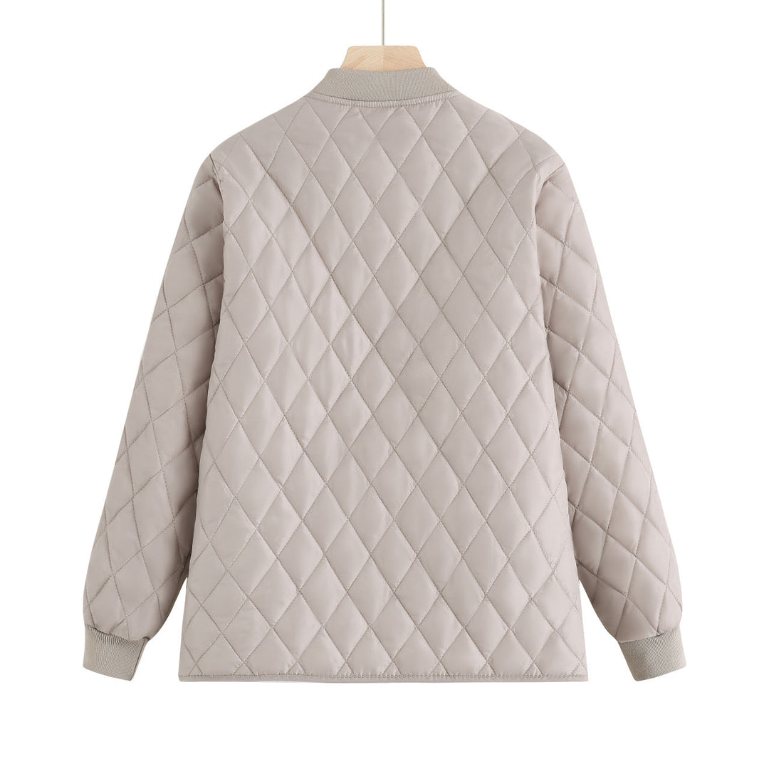 Dam quiltad övergångsjacka med diamond stitching och ribbed krage
