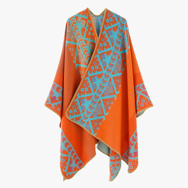 Dam capeponcho i woven ethnic jacquard tillverkad av ullblandning med zigzag fåll edge