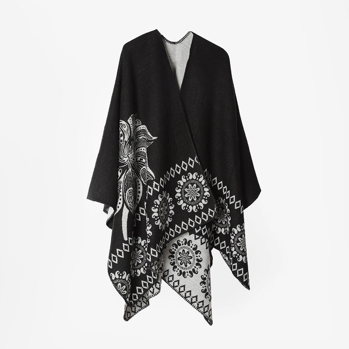 Dam poncho cape med two-tone woven texture, floral medallion jacquard, och öppen front.