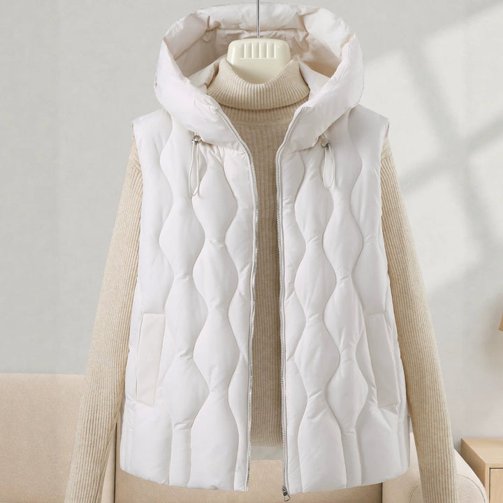 Dam longer skärning quiltad väst med huva, wave quiltning och detachable dragkedja