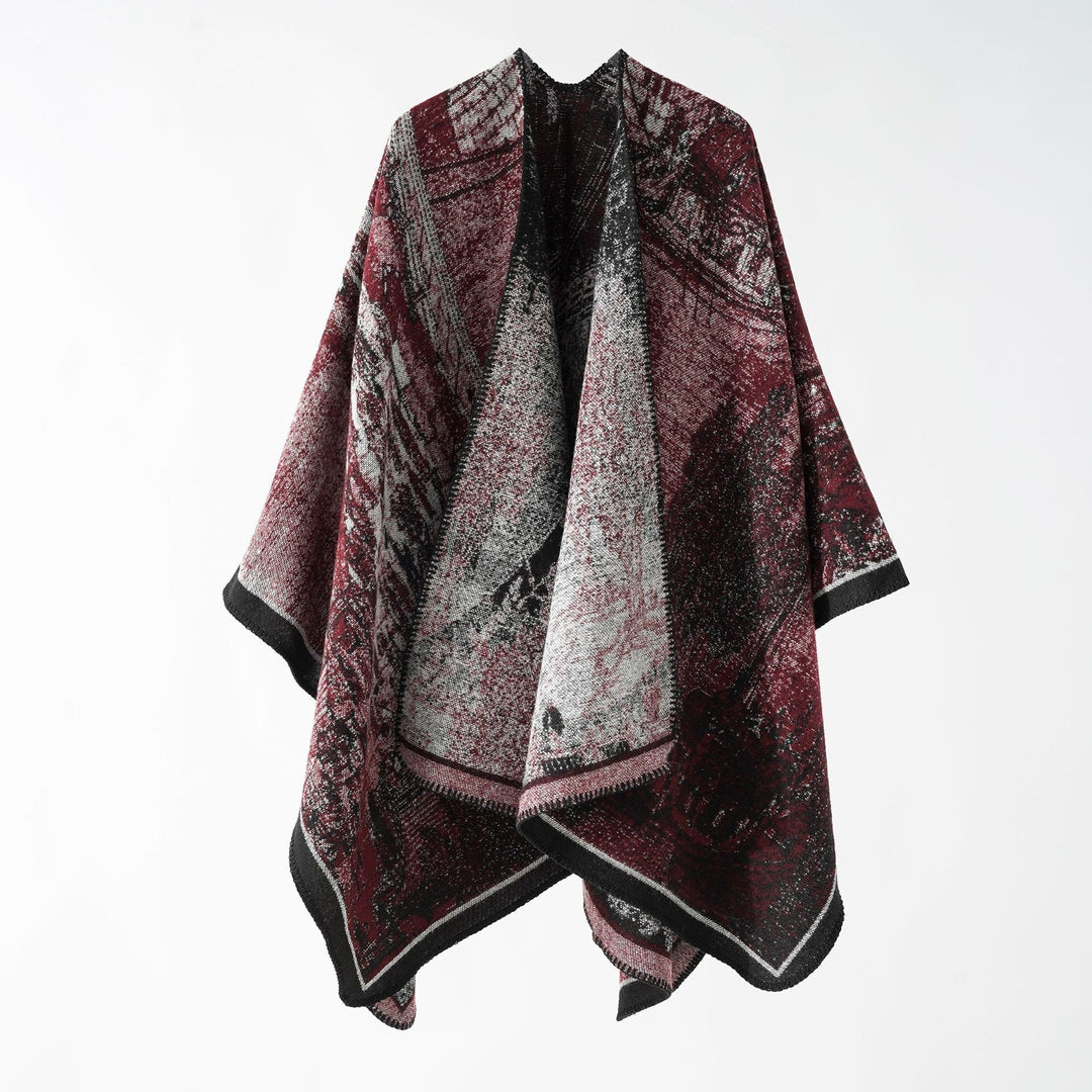 Dam jacquard stickad cape med textured woven look och öppen front