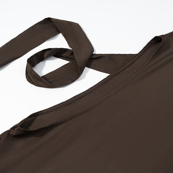 Dam fallande capeponcho med bow, asymmetrical pointed fåll och eyelet kant