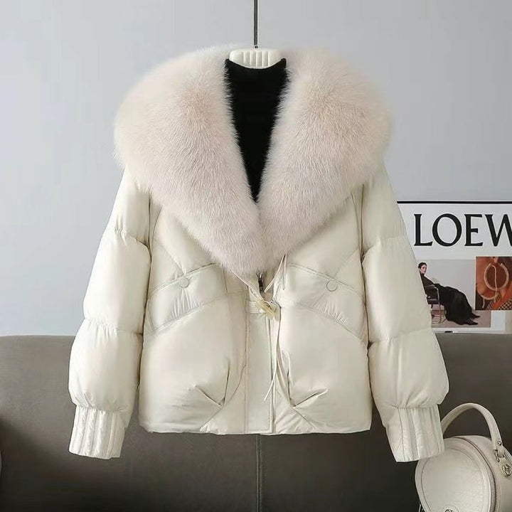 Dam nan kort vadderad jacka med voluminous faux fur krage och midja draw