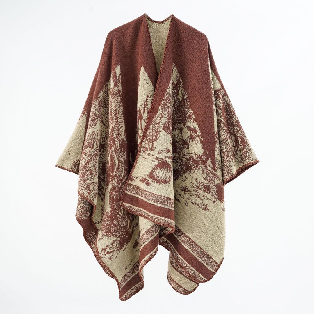 Dam capeponcho tillverkad av ullblandning med two-tone jacquard structure och decorative stitch border