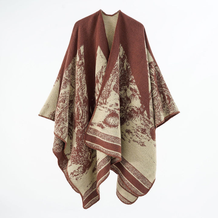 Dam capeponcho tillverkad av ullblandning med two-tone jacquard structure och decorative stitch border
