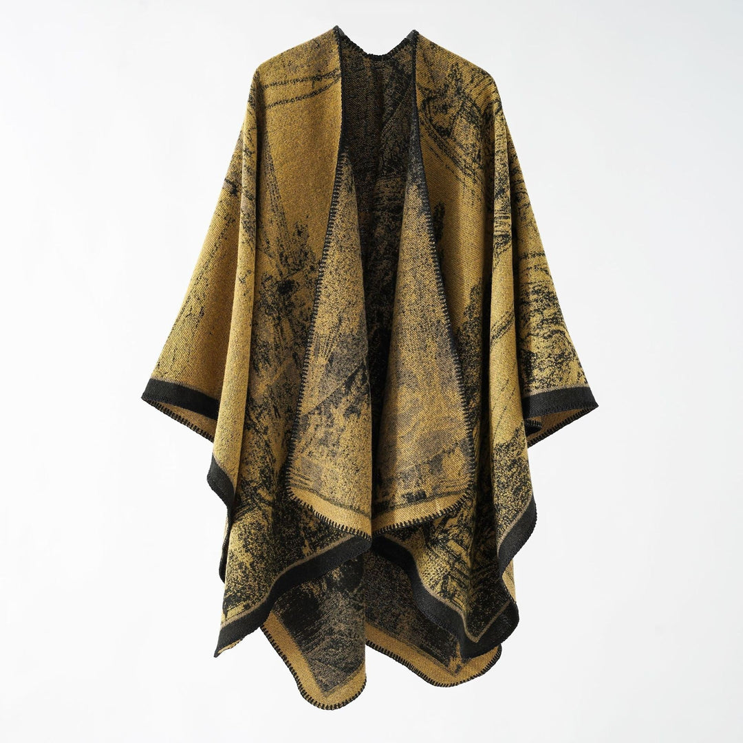 Dam jacquard stickad cape med textured woven look och öppen front